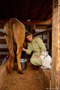 Trent Nelson  |  The Salt Lake Tribune flds girls milking cow, Tuesday May 9, 2017.