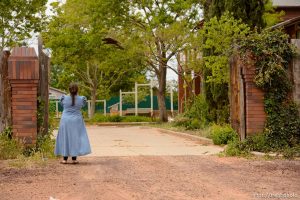 Trent Nelson  |  The Salt Lake Tribune An FLDS girl watches the eviction of an empty home in Colorado City, AZ, Tuesday May 9, 2017.