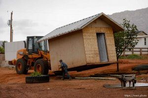 Trent Nelson  |  The Salt Lake Tribune An FLDS man removes a shed from a property in Colorado City, AZ, Tuesday May 9, 2017, as the locks are changed by the UEP Trust on the home next door.