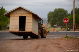 Trent Nelson  |  The Salt Lake Tribune An FLDS man removes a shed from a property in Colorado City, AZ, Tuesday May 9, 2017, as the locks are changed by the UEP Trust on the home next door.