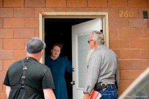 Trent Nelson  |  The Salt Lake Tribune FLDS member Julia Johnson confronts Mohave County Constable Mike Hoggard, disputing the UEP Trust's ability to evict her from a property in Colorado City, AZ, Tuesday May 9, 2017. Ted Barlow at left.