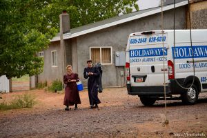 Trent Nelson  |  The Salt Lake Tribune Two FLDS women are evicted from a home in Colorado City, AZ, Tuesday May 9, 2017, and walk off in the rain.