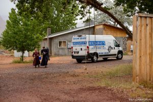 Trent Nelson  |  The Salt Lake Tribune
Two FLDS women are evicted from a home in Colorado City, AZ, Tuesday May 9, 2017, and walk off in the rain.