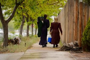 Trent Nelson  |  The Salt Lake Tribune Two FLDS women are evicted from a home in Colorado City, AZ, Tuesday May 9, 2017, and walk off in the rain.