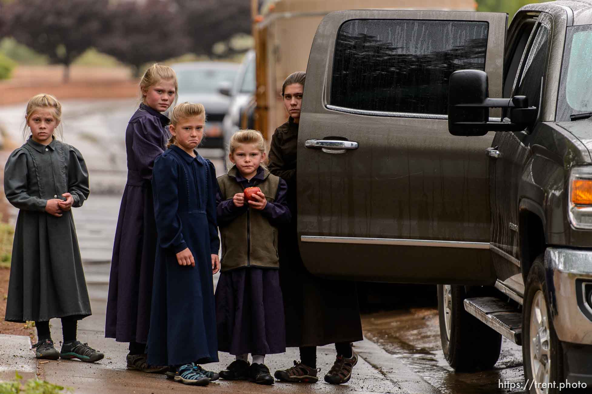 Trent Nelson  |  The Salt Lake Tribune
FLDS children look on after being evicted from their Colorado City, AZ, home by the UEP Trust after refusing to sign an occupancy agreement, Wednesday May 10, 2017.
