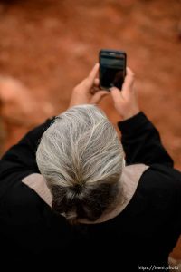 Trent Nelson  |  The Salt Lake Tribune An FLDS woman films the UEP eviction of property at 560 E Johnson Ave, Colorado City, AZ, Wednesday May 10, 2017.