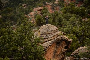 Trent Nelson  |  The Salt Lake Tribune FLDS boy photographs from the top of a rock as the UEP changes the locks on the home at 560 E Johnson Ave, Colorado City, AZ, Wednesday May 10, 2017.