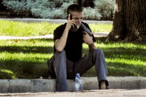 (Trent Nelson | The Salt Lake Tribune)  A young man holds a gun to his head during a standoff with police in Salt Lake City, Friday September 1, 2017.