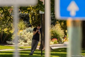 (Trent Nelson | The Salt Lake Tribune)  A young man holds a gun to his head during a standoff with police in Salt Lake City, Friday September 1, 2017.
