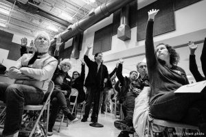 (Trent Nelson | The Salt Lake Tribune) Upset community members attend a meeting over worry that a ban on big trucks on Legacy Parkway is about to expire, unless the Legislature extends it. Residents raise their hand in support of not raising the speed limit on the Parkway during the meeting at Foxboro Elementary School in North Salt Lake on Wednesday Jan. 16, 2019.
