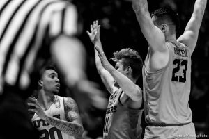 (Trent Nelson | The Salt Lake Tribune)   Utah Utes forward Timmy Allen (20) looks to pass, defended by Oregon State Beavers guard Zach Reichle (11) and Oregon State Beavers center Gligorije Rakocevic (23) as Utah hosts Oregon State, NCAA basketball in Salt Lake City on Saturday Feb. 2, 2019.