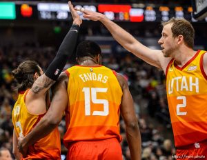 (Trent Nelson | The Salt Lake Tribune)   Utah Jazz guard Ricky Rubio (3) and Utah Jazz forward Joe Ingles (2) high-five over Utah Jazz forward Derrick Favors (15) as the Utah Jazz host the San Antonio Spurs, NBA basketball in Salt Lake City on Saturday Feb. 9, 2019.