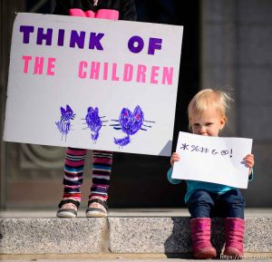 (Trent Nelson | The Salt Lake Tribune)  
Miranda and Valerie Kemeny hold signs as students gather to call for action on climate change at the Utah Capitol in Salt Lake City on Friday March 15, 2019.