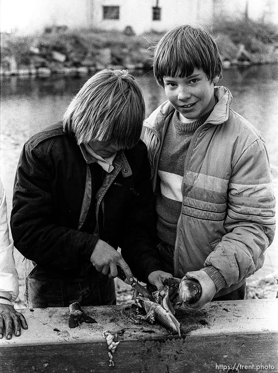 Kids cutting up a fish, 1987.