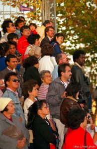 People watch the Pope drive by at the Pope's visit.