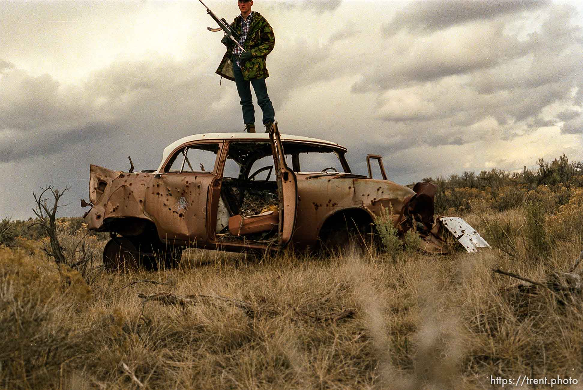 gun and camo on old car