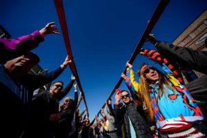 (Trent Nelson  |  The Salt Lake Tribune)  
Participants lift up their skis on Park City’s Historic Main Street after drinking a shot at the annual Shot Ski event on Saturday Oct. 12, 2019.