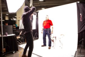 (Trent Nelson  |  The Salt Lake Tribune)
Volunteer Dave Brewer photographs Chris Ponton and his dog Minnie at Project Homeless Connect, where community volunteers to provide services for individuals and families experiencing homelessness, at the Salt Palace Convention Center in Salt Lake City on Friday Oct. 25, 2019. Brewer is with Photo Collective Studios.