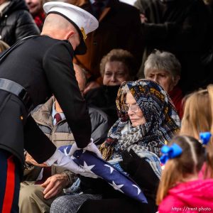 (Trent Nelson  |  The Salt Lake Tribune) A flag is presented to Charmain Hatch, sister-in-law of Marine Pfc. Robert J. Hatch, at the Bountiful City Cemetery on Saturday Dec. 14, 2019. Hatch was killed in action Nov. 22, 1943 on the island of Betio.