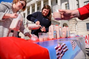 (Trent Nelson  |  The Salt Lake Tribune) Sara Hart and Kate Reymann pour chocolate milke at a rally in support of Sen. Mitt Romney at the state Capitol in Salt Lake City on Friday, Feb. 28, 2020. Mormon Women for Ethical Government and other  groups organized the rally.