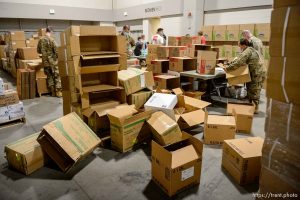 (Trent Nelson  |  The Salt Lake Tribune) Workers organize supplies at the Receiving, Staging and Shipping Center at the Salt Palace Convention Center in Salt Lake City on Friday, May 8, 2020. The center serves as a central location for personal protective equipment received by the State of Utah and sent to hospitals, local health departments and emergency managers.