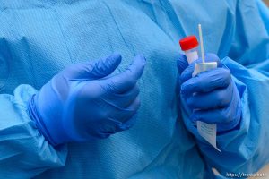 (Trent Nelson  |  The Salt Lake Tribune) Jessica Picaso, right, and Estefania Mondragon test a patient for COVID-19 during an event sponsored by Comunidades Unidas at Mid-Valley Health Clinic in Midvale on Wednesday, May 20, 2020. The event was also sponsored by the Utah Partners for Health, Mid-Valley Health Clinic and the Utah Department of Health.