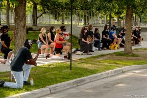 (Trent Nelson  |  The Salt Lake Tribune) A small group of Black Lives Matter activists led by Victoria Crosby kneel with National Guard and Salt Lake Police in front of the Public Safety Building in Salt Lake City on Tuesday, June 2, 2020.