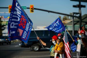 (Trent Nelson  |  The Salt Lake Tribune) A group of Trump supporters wave flags on the corner of 2100 S State Street in Salt Lake City on Tuesday, Nov. 3, 2020.
