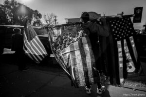 (Trent Nelson  |  The Salt Lake Tribune) A group of Trump supporters wave flags on the corner of 2100 S State Street in Salt Lake City on Tuesday, Nov. 3, 2020.