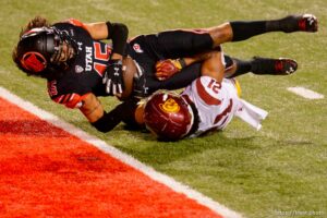 (Trent Nelson  |  The Salt Lake Tribune) Utah Utes wide receiver Samson Nacua (45) scores a touchdown, with USC Trojans safety Isaiah Pola-Mao (21) defending, as the Utah Utes host the USC Trojans, NCAA football at Rice-Eccles Stadium in Salt Lake City on Saturday, Nov. 21, 2020.