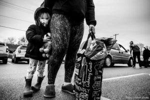 (Trent Nelson  |  The Salt Lake Tribune) Gia stands next to her mother Kajsa after picking up bags of food at Liberty Elementary in Salt Lake City on Thursday, Dec. 17, 2020.