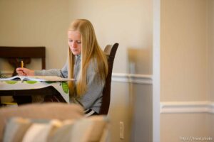 (Trent Nelson  |  The Salt Lake Tribune) Kate Bowen, a ninth grader at Hillcrest Junior High, does online schoolwork at her home in Murray on Wednesday, Jan. 13, 2021.