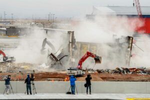 (Trent Nelson  |  The Salt Lake Tribune) The Delta Tower at the Salt Lake City International Airport is demolished on Monday, Feb. 15, 2021. The tower was originally built around 1989-90 for Delta Air Lines to direct aircraft to their gates after the FAA hands over the planes. The tower, which stands at 84 feet high, continued to operate until The New SLC opened on Sept. 15 and the replacement Delta tower became operational.