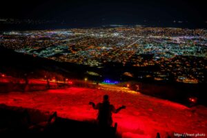 (Trent Nelson  |  The Salt Lake Tribune) A group of people, including many BYU students, shine Pride colors on the Y on the mountain above BYU in Provo on Thursday, March 4, 2021.