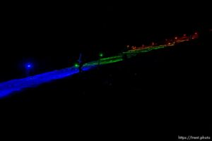 (Trent Nelson  |  The Salt Lake Tribune) A group of people, including many BYU students, shine Pride colors on the Y on the mountain above BYU in Provo on Thursday, March 4, 2021.