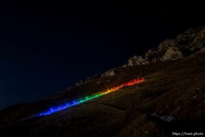 (Trent Nelson  |  The Salt Lake Tribune) A group of people, including many BYU students, shine Pride colors on the Y on the mountain above BYU in Provo on Thursday, March 4, 2021.