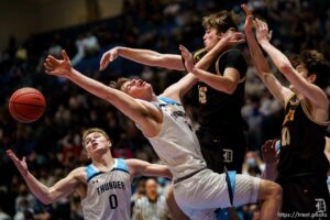 (Trent Nelson  |  The Salt Lake Tribune) Westlake's Noah Madsen and Noah McCord reach for a loose ball as Davis defeats Westlake High School in the 6A boys basketball state championship game, in Taylorsville on Saturday, March 6, 2021.