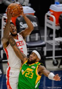 (Trent Nelson  |  The Salt Lake Tribune) Houston Rockets center Justin Patton (26) and Utah Jazz forward Royce O'Neale (23) reach for the ball as the Utah Jazz host the Houston Rockets, NBA basketball in Salt Lake City on Friday, March 12, 2021.