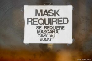 (Trent Nelson  |  The Salt Lake Tribune) Signs indicating masks are required at a store in West Valley City on Tuesday, March 16, 2021.