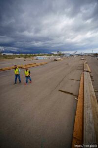 (Trent Nelson  |  The Salt Lake Tribune) Jason Butterfield and Jason Barnett walk through the sparse yard a Sunpro in Salt Lake City on Tuesday, April 27, 2021. A national shortage of lumber is stalling and driving up costs on big construction projects and small home improvements alike in Utah.