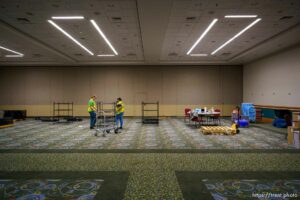 (Trent Nelson  |  The Salt Lake Tribune) Maria Guzman and Kai Pakulski break down a supply room on the last day the Salt Lake County Health Department's COVID-19 vaccine operation was open at the Salt Palace Convention Center in Salt Lake City, Saturday, May 29, 2021.