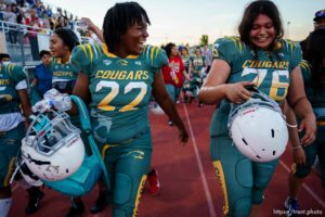 (Trent Nelson  |  The Salt Lake Tribune) Kearns' Ashley Hawkins and Naliyah Rueckert celebrates their win over the Herriman Sting in the Utah Girls Tackle Football League Division 2 championship game at Herriman High School on Thursday, May 27, 2021.
