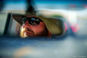 (Trent Nelson  |  The Salt Lake Tribune) Skyler Marshall, street outreach case manager for the nonprofit Youth Futures, driving in St. George on Friday, June 11, 2021.