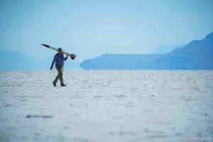 (Trent Nelson  |  The Salt Lake Tribune) Ben Cook carries his rocket Zephyr. Utah Rocket Club hosted Large Dangerous Rocket Ships, one of the country's premier rocketry events, at the Bonneville Salt Flats on Saturday, July 31, 2021.