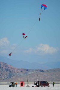 (Trent Nelson  |  The Salt Lake Tribune) A rocket returns to the ground, drifting down on two parachutes. Utah Rocket Club hosted Large Dangerous Rocket Ships, one of the country's premier rocketry events, at the Bonneville Salt Flats on Saturday, July 31, 2021.