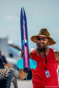 (Trent Nelson  |  The Salt Lake Tribune) Ryan Terry carries his rocket, Apogee Peregrine. Utah Rocket Club hosted Large Dangerous Rocket Ships, one of the country's premier rocketry events, at the Bonneville Salt Flats on Saturday, July 31, 2021.