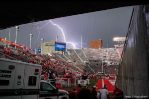 (Trent Nelson  |  The Salt Lake Tribune) Lightning flashes over Rice-Eccles Stadium as a storm blew through as the Utah Utes host the Weber State Wildcats in Salt Lake City on Thursday, Sept. 2, 2021.