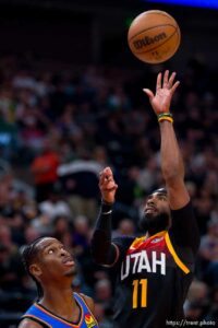 (Trent Nelson  |  The Salt Lake Tribune) Utah Jazz guard Mike Conley (11) and Oklahoma City Thunder guard Shai Gilgeous-Alexander (2) as the Utah Jazz host the Oklahoma City Thunder, NBA basketball in Salt Lake City on Wednesday, Oct. 20, 2021.