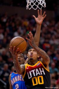 (Trent Nelson  |  The Salt Lake Tribune) Utah Jazz guard Jordan Clarkson (00) and Oklahoma City Thunder guard Shai Gilgeous-Alexander (2) as the Utah Jazz host the Oklahoma City Thunder, NBA basketball in Salt Lake City on Wednesday, Oct. 20, 2021.