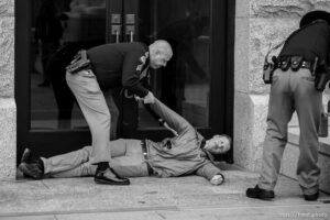 (Trent Nelson  |  The Salt Lake Tribune) Bobby Kennedy is handcuffed after blocking an entrance at the State Capitol as the Utah Legislature hold a special session in Salt Lake City on Tuesday, Nov. 9, 2021. Kennedy expressed his disgust at the redistricting maps put out by the Legislature and said, 